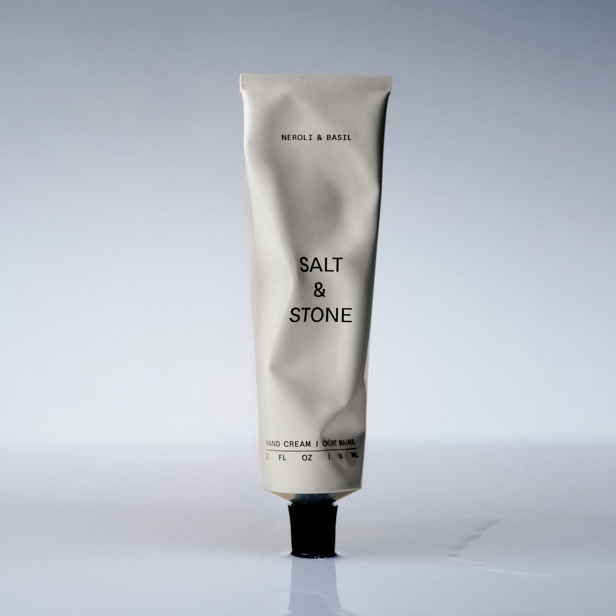 Salt & Stone Handcreme - Neroli & Basil, 60ml – Tube im Licht